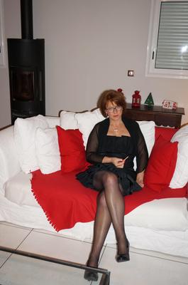 Anna in black dress and black lingerie showing off