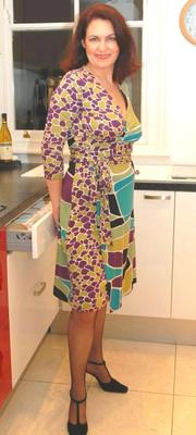 Mature undresses in the kitchen