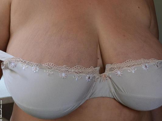 Mature brunette with big saggy boobs