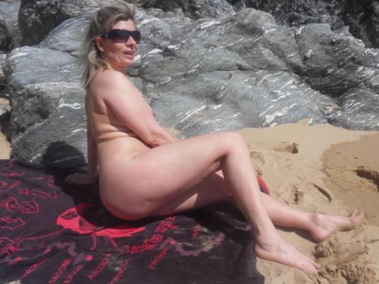 Lisa archs her big fat slut ass on the beach